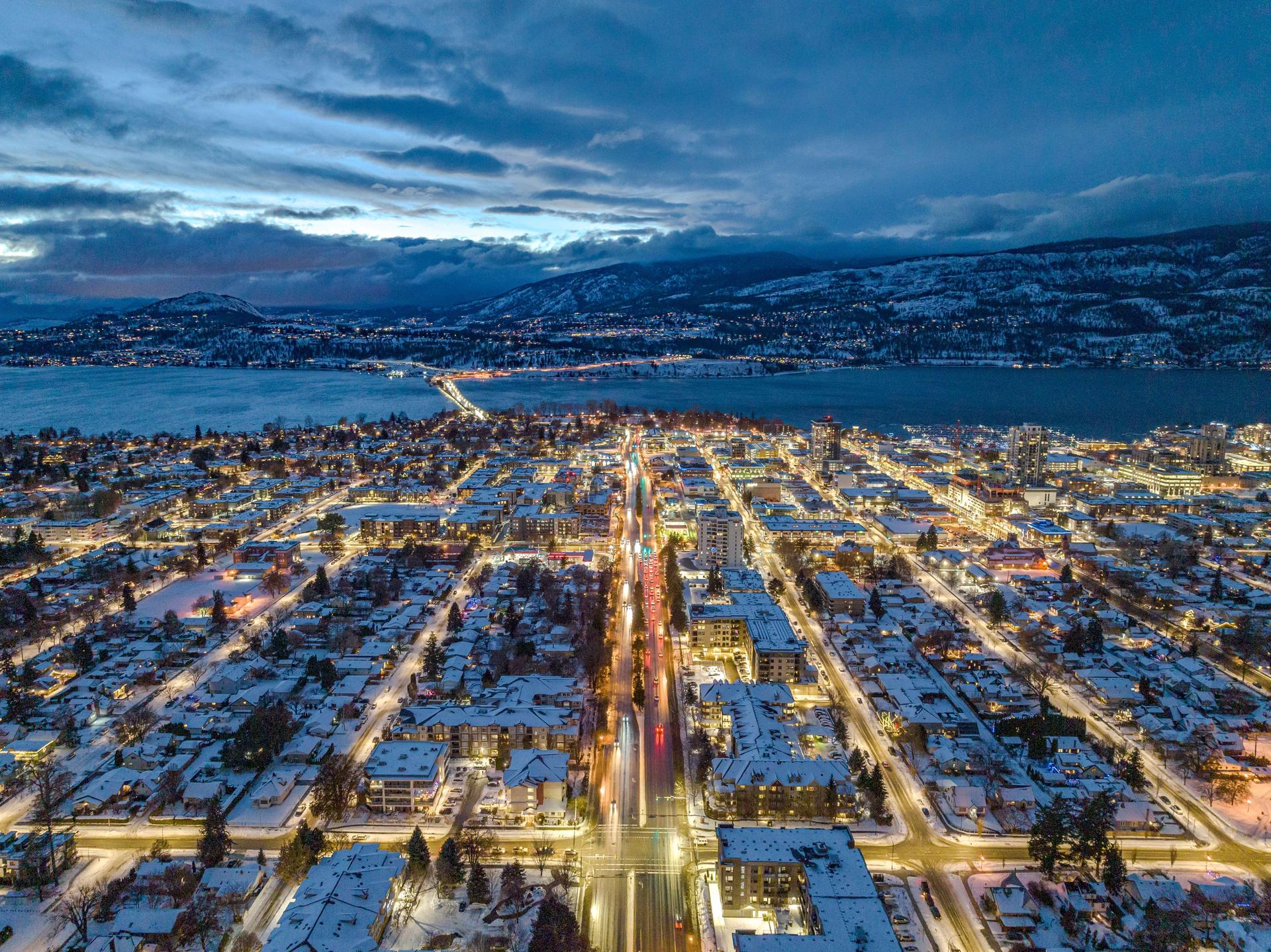 Drone shot of buildings in Kelowna, British Columbia, Canada in the evening