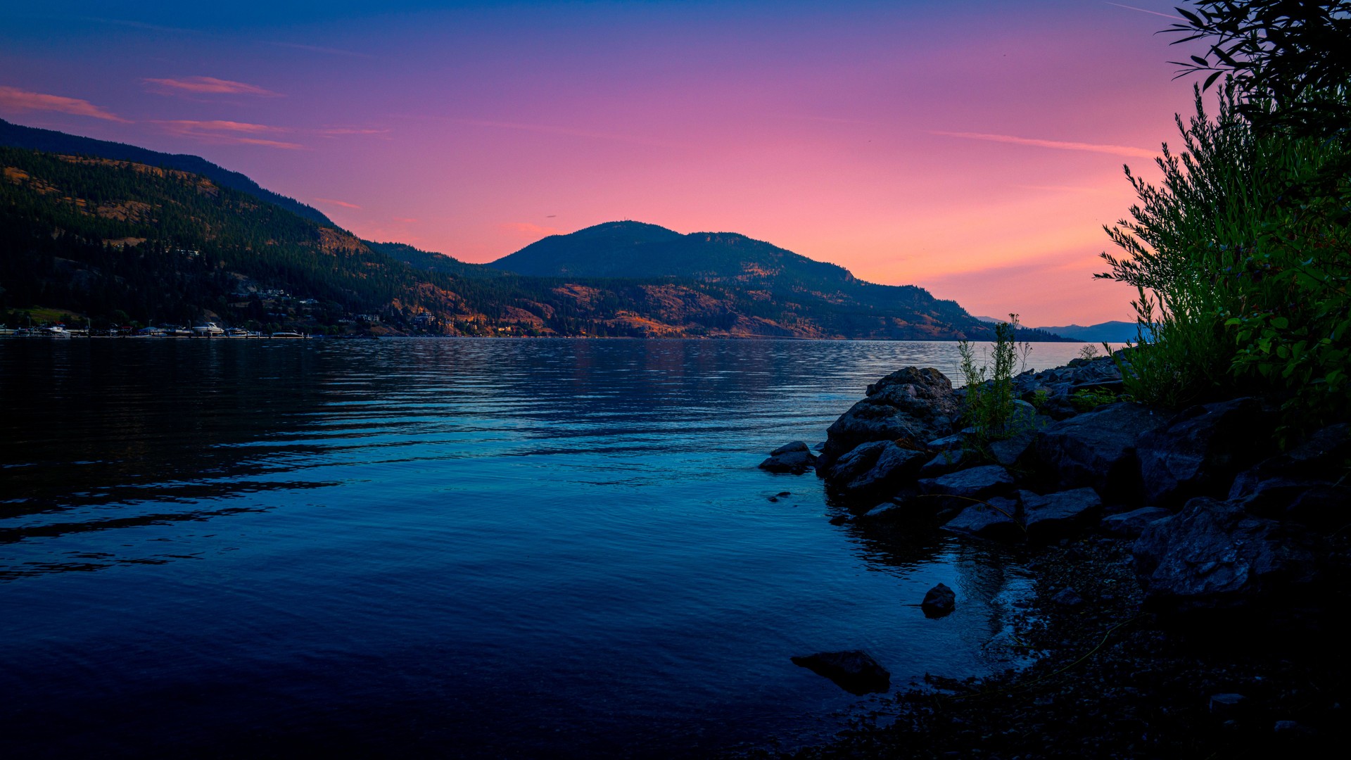 Kelowna skyline at sunset over Okanagan Lake in British Columbia, western Canada, Okanagan Valley Wine Country landscape